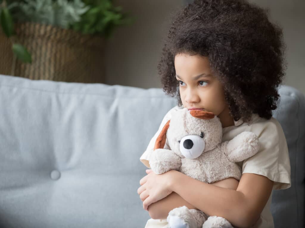 child with teddy bear