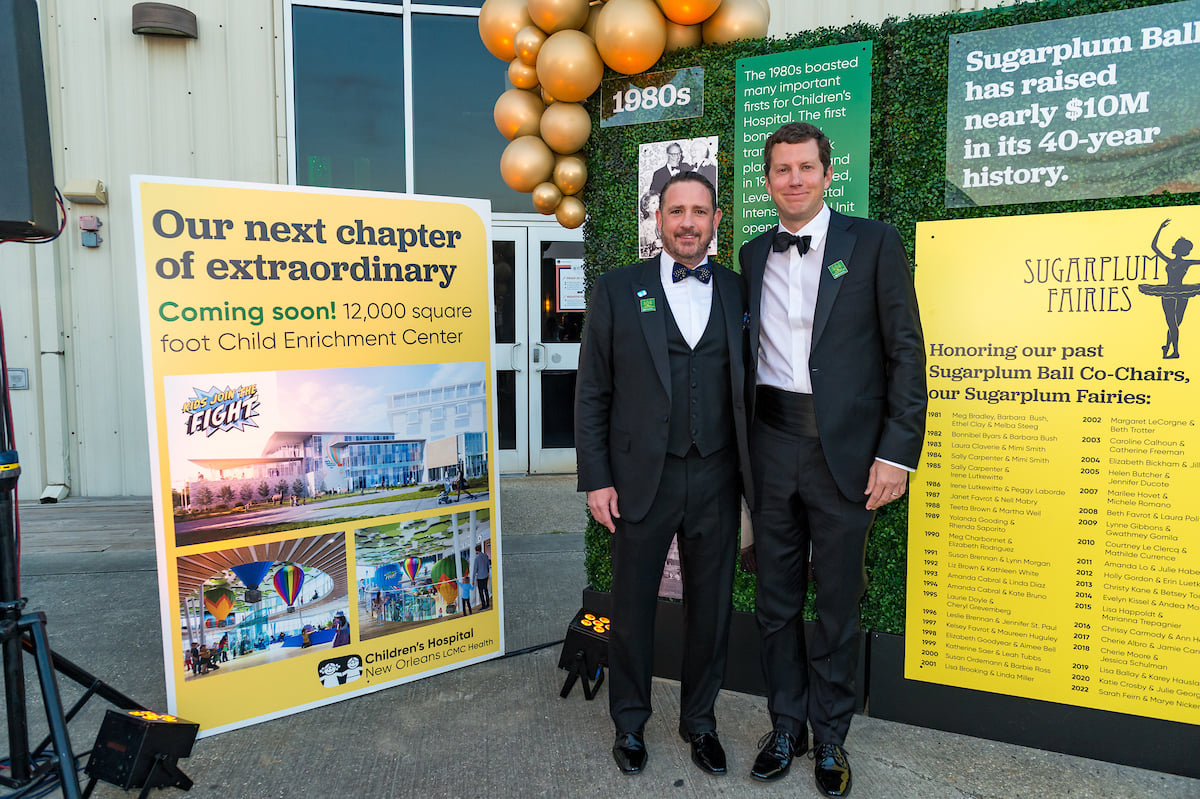 2 dressed up men at an event