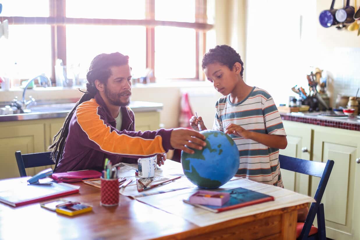 father and son working on crafts