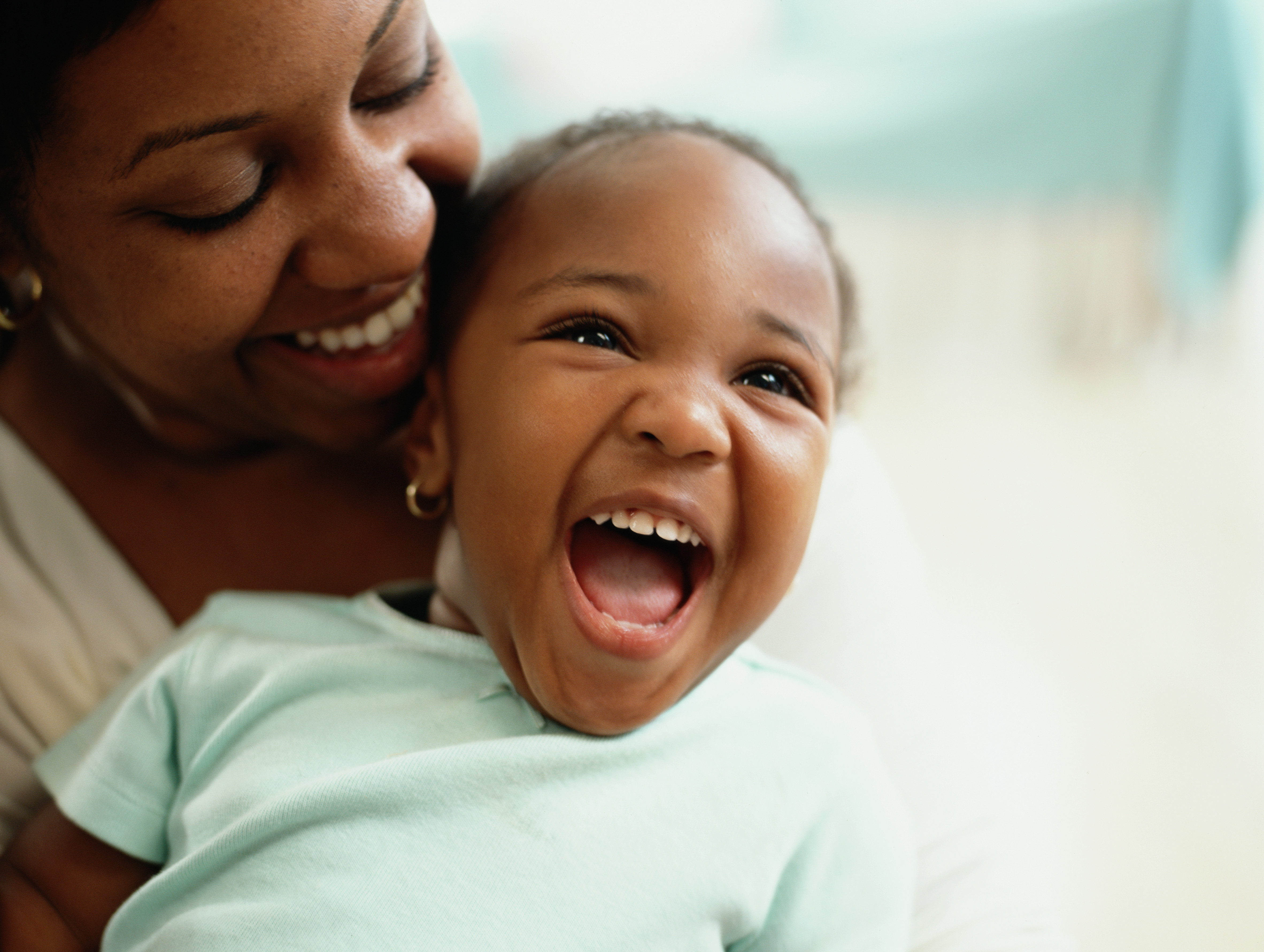 smiling child with mother