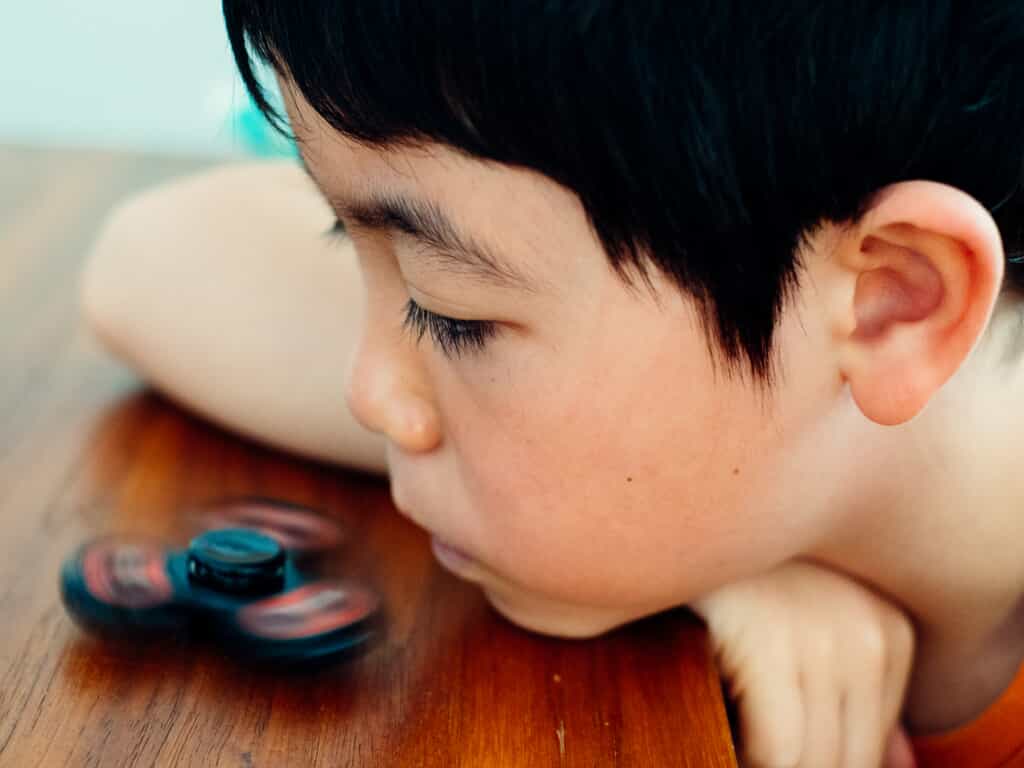 sad young boy looking down