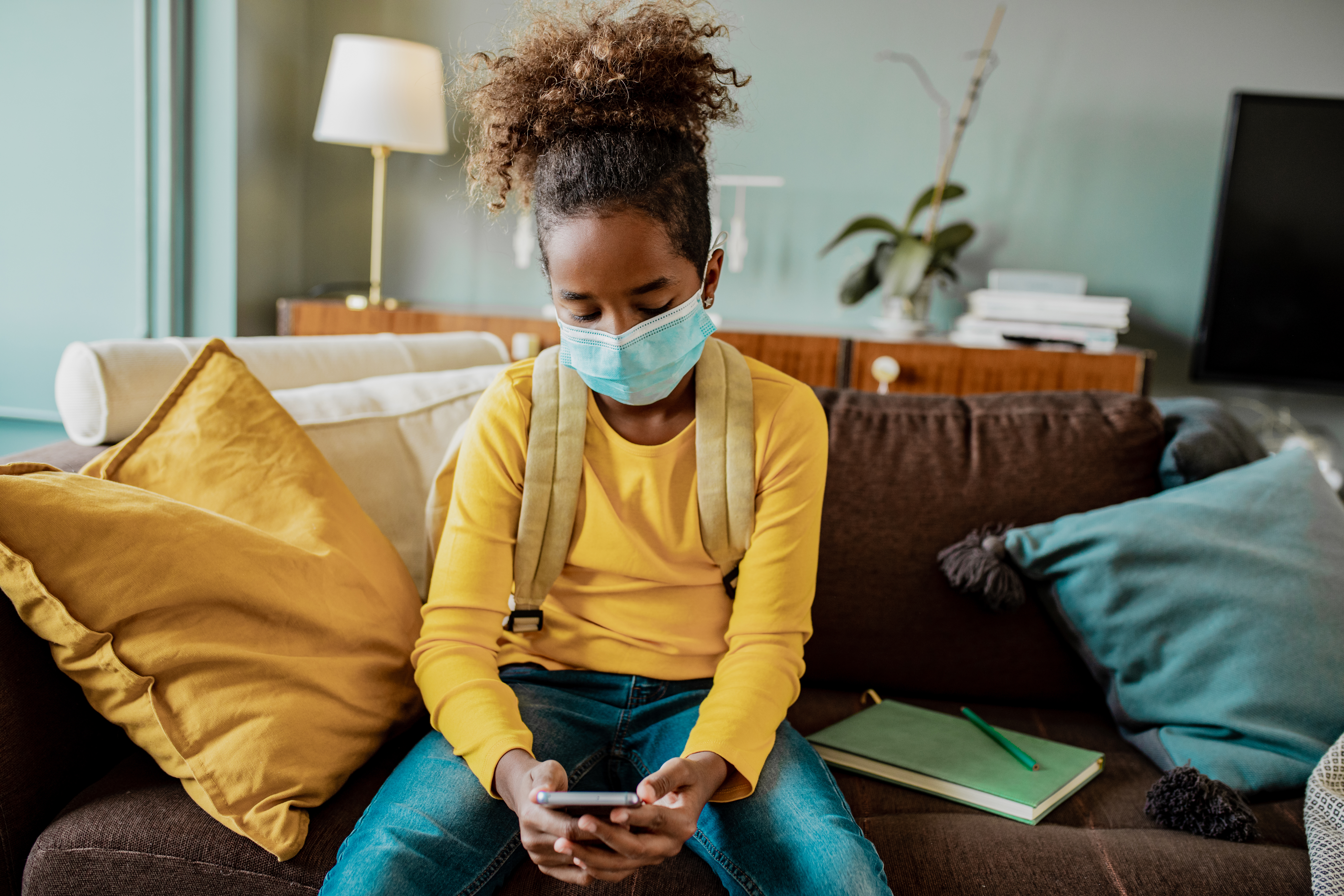 child looking sad with mask on