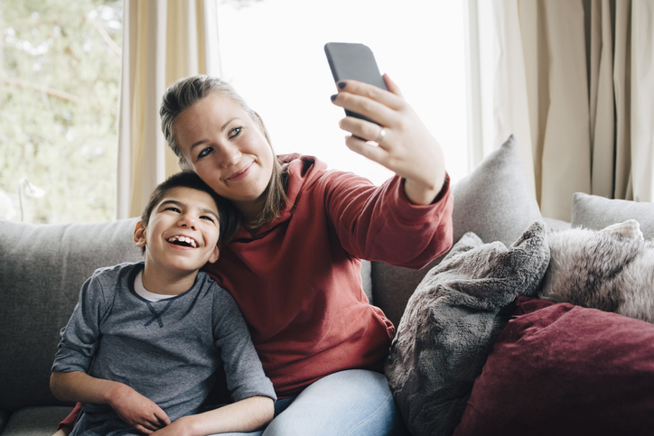 son and mom taking selfie