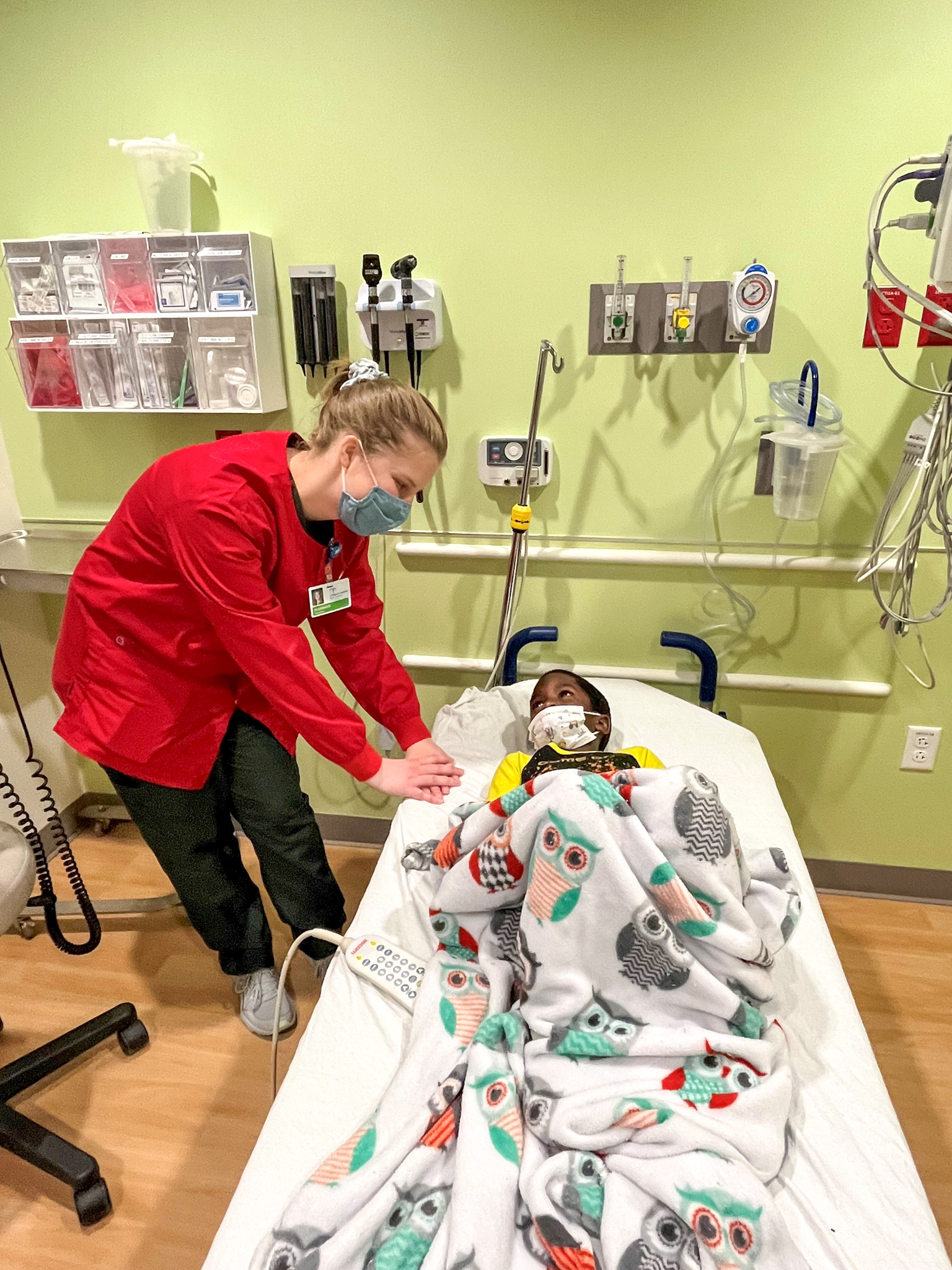 nurse checking on child patient