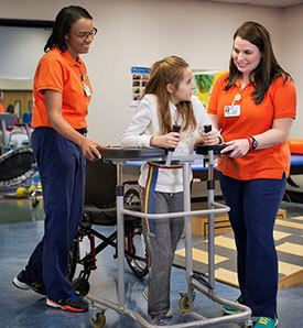 Child with Two Physical Therapists