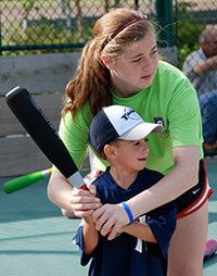 Kids playing baseball with the Miracle League