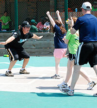 Girl making a home run with the Miracle League