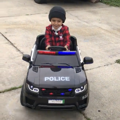 Child cancer patient in toy car